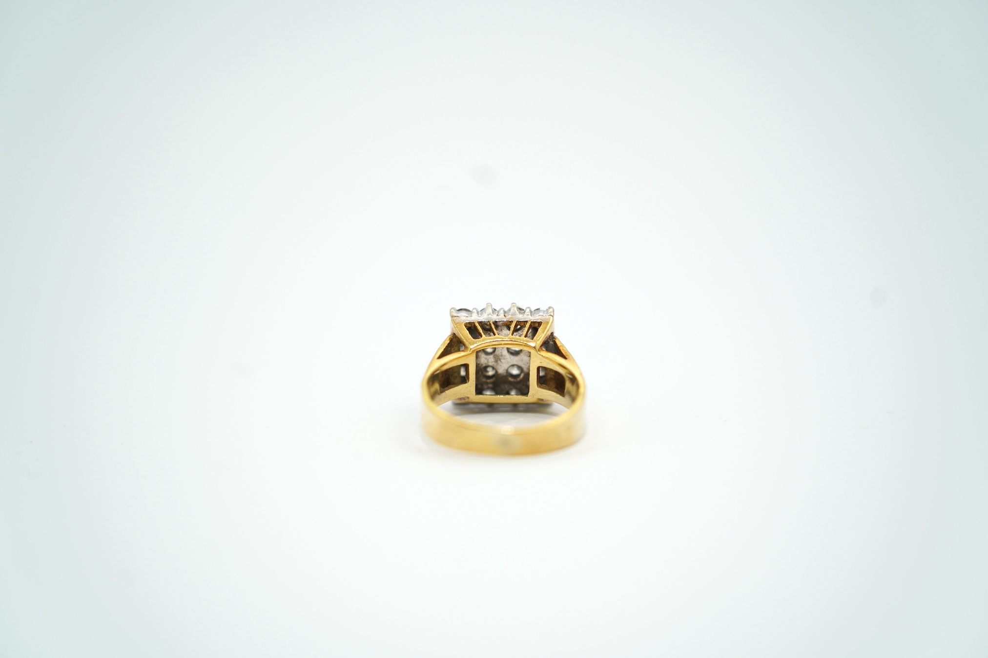 A modern textured 18ct gold and diamond cluster set tablet ring, size K/L, gross weight 6.8 grams. Condition - fair